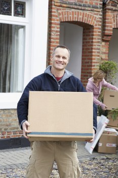 Furniture pick-up service removing a sofa in Roehampton