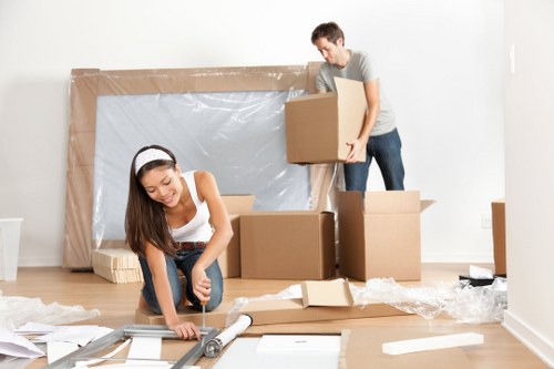Office removals planning in Roehampton with packed boxes and moving trolleys