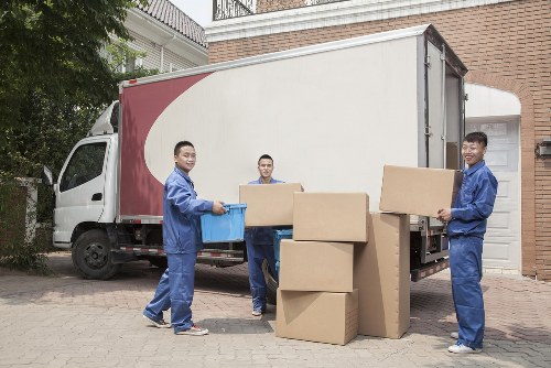 Removal team loading furniture into a van