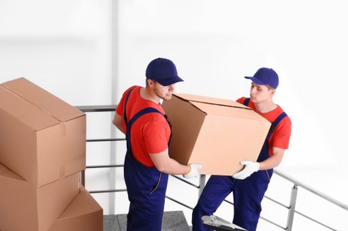 Professional movers handling furniture during a Roehampton relocation