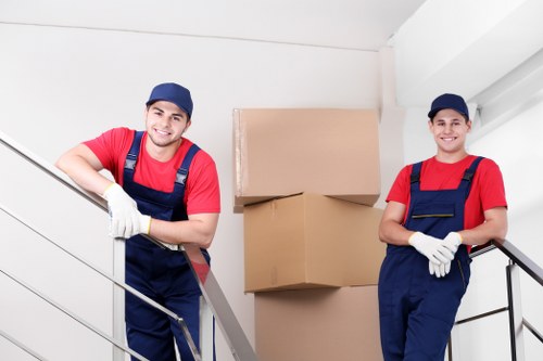 Removal team handling boxes during a Roehampton house move