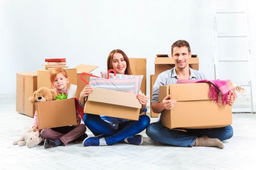 Professional movers loading boxes for a Roehampton relocation