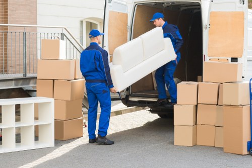 Professional removal service loading fragile belongings carefully