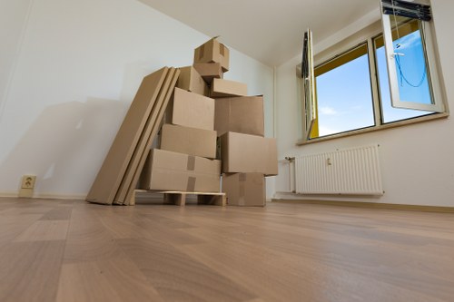 Professional movers carrying furniture in Roehampton
