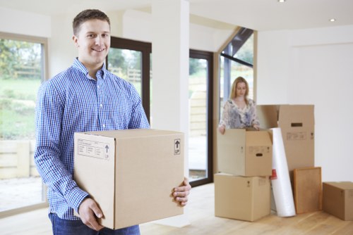Professional movers handling large furniture during a Roehampton relocation
