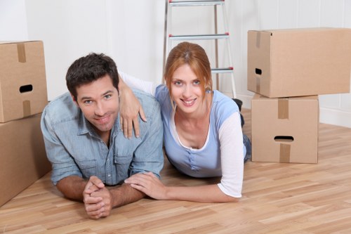 Boxes and furniture being loaded into a moving van