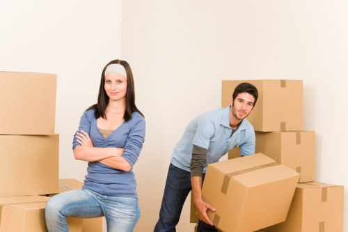 Professional movers organizing belongings for a local relocation in Roehampton