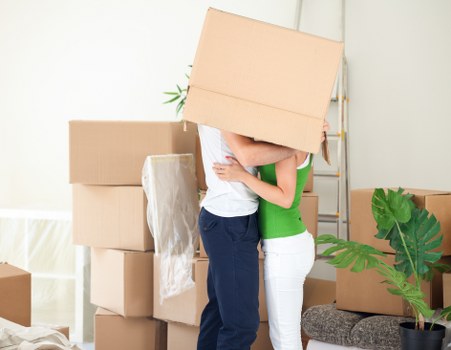 Packed boxes and furniture prepared for a home move in Roehampton