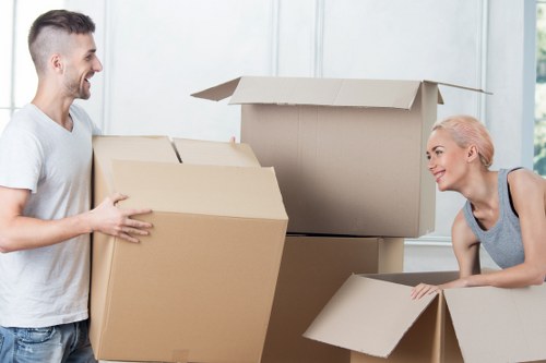 Specialist movers transporting a piano through a Roehampton property
