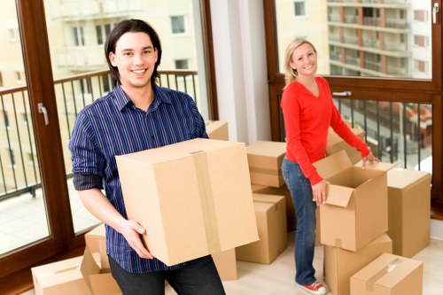 House removals team handling furniture in Roehampton