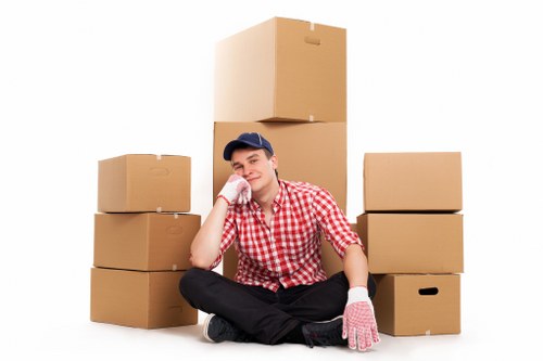 Professional mover transporting furniture in Roehampton